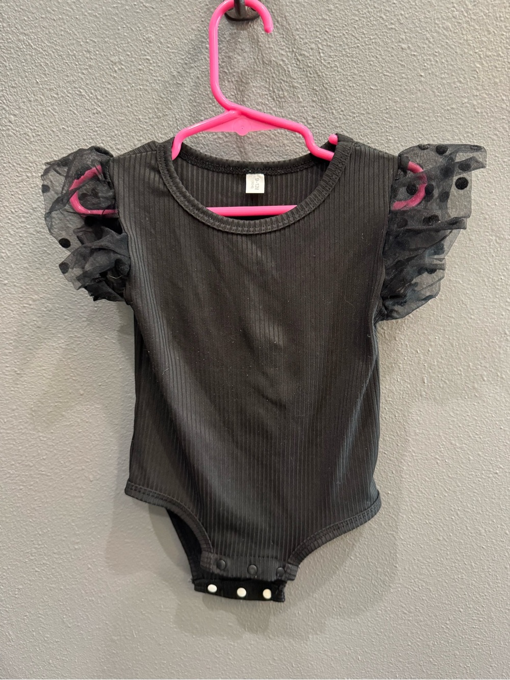 Black Ribbed Baby One-Piece Bodysuit with Sheer Polka Dot Ruffle Sleeves